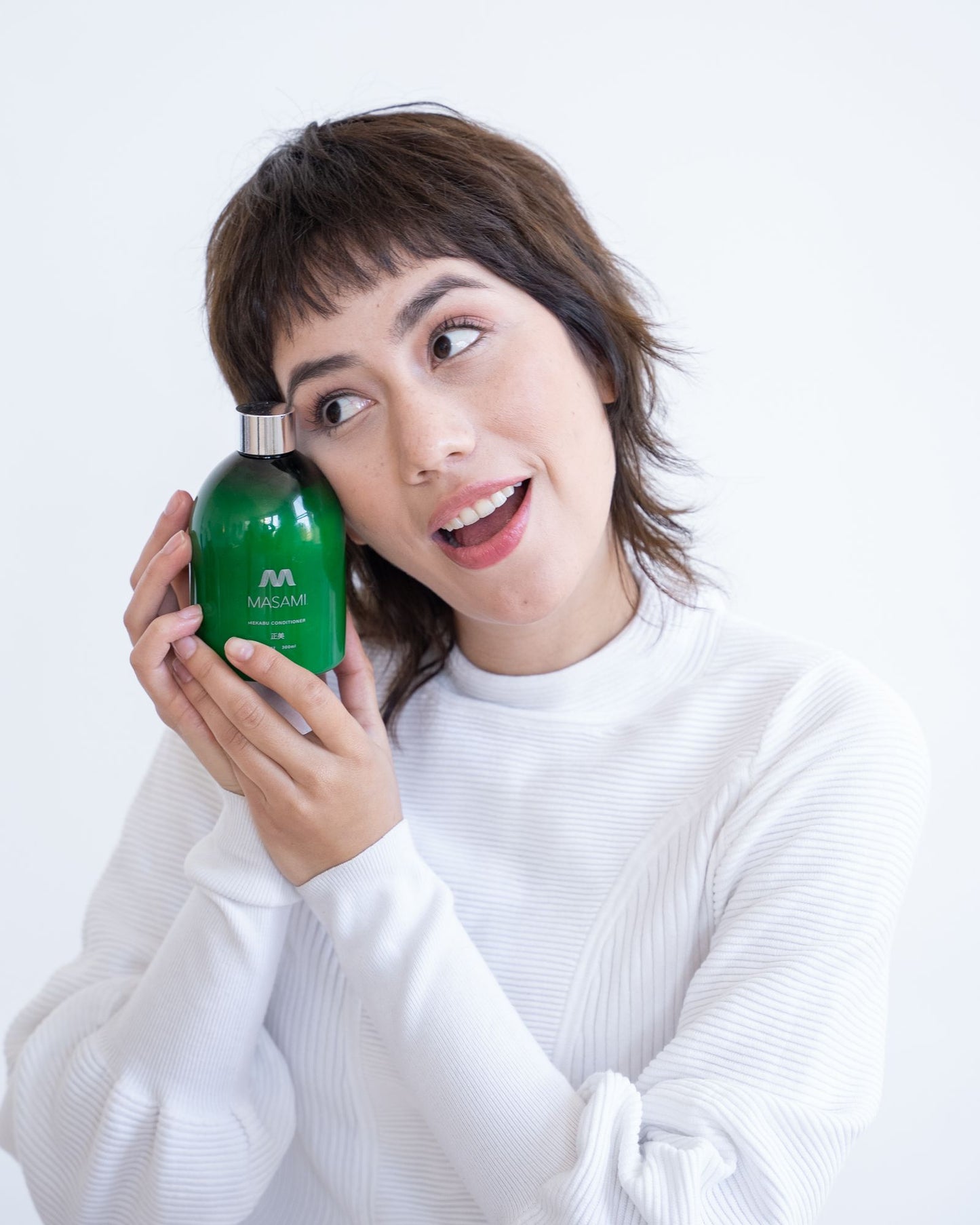 Masami Mekabu Hydrating Conditioner and woman with smile