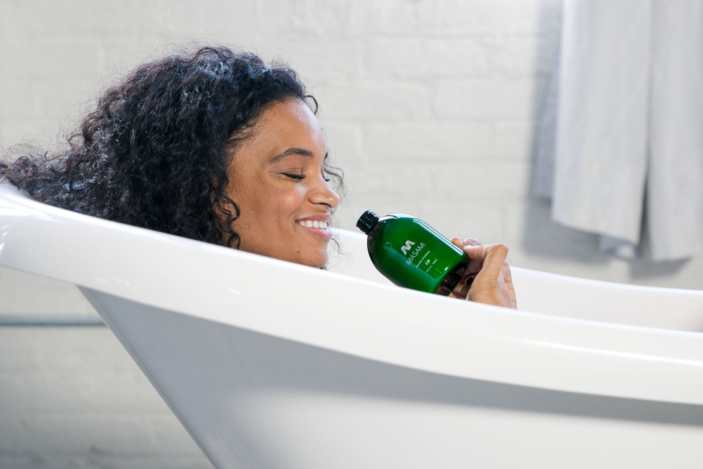 Masami Mekabu Hydrating Shampoo with woman in bath